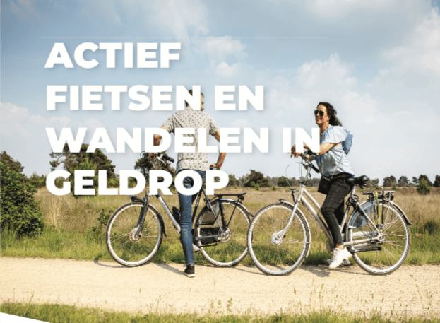 Koppel op de fiets in de natuur met de tekst Actief fietsen en wandelen in Geldrop